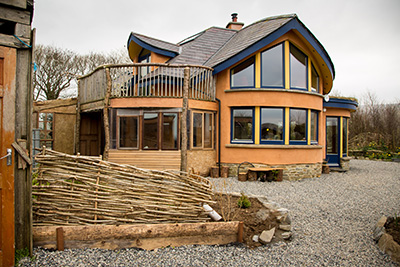 rear porch of mud and wood house